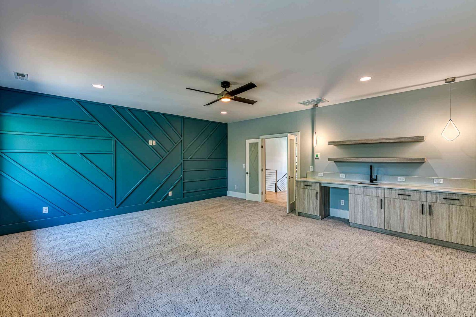 Lower level lounge with billiards table by Shail Construction in Raleigh NC
