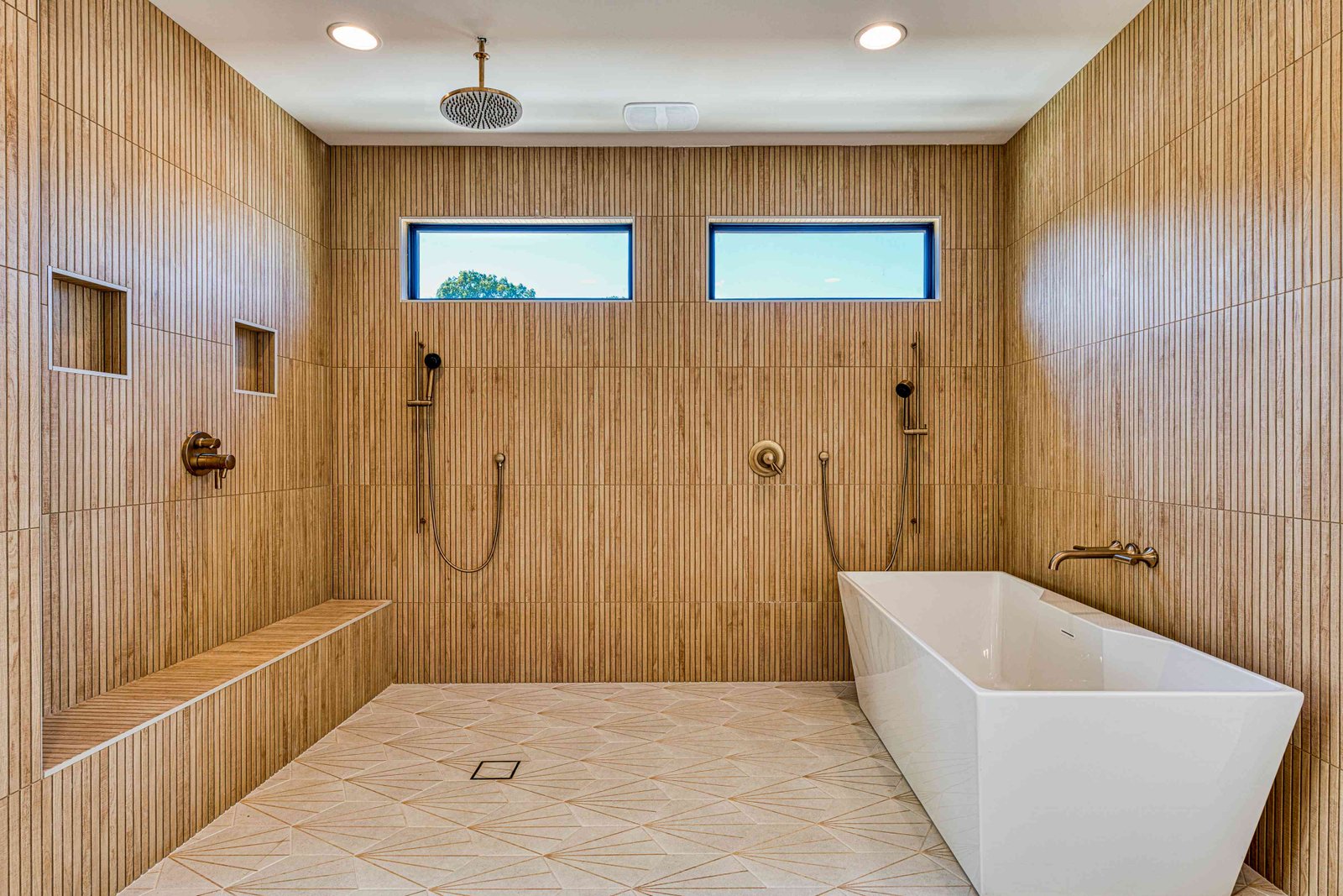Master bathroom with double vanity and freestanding tub by Shail Construction in Raleigh NC
