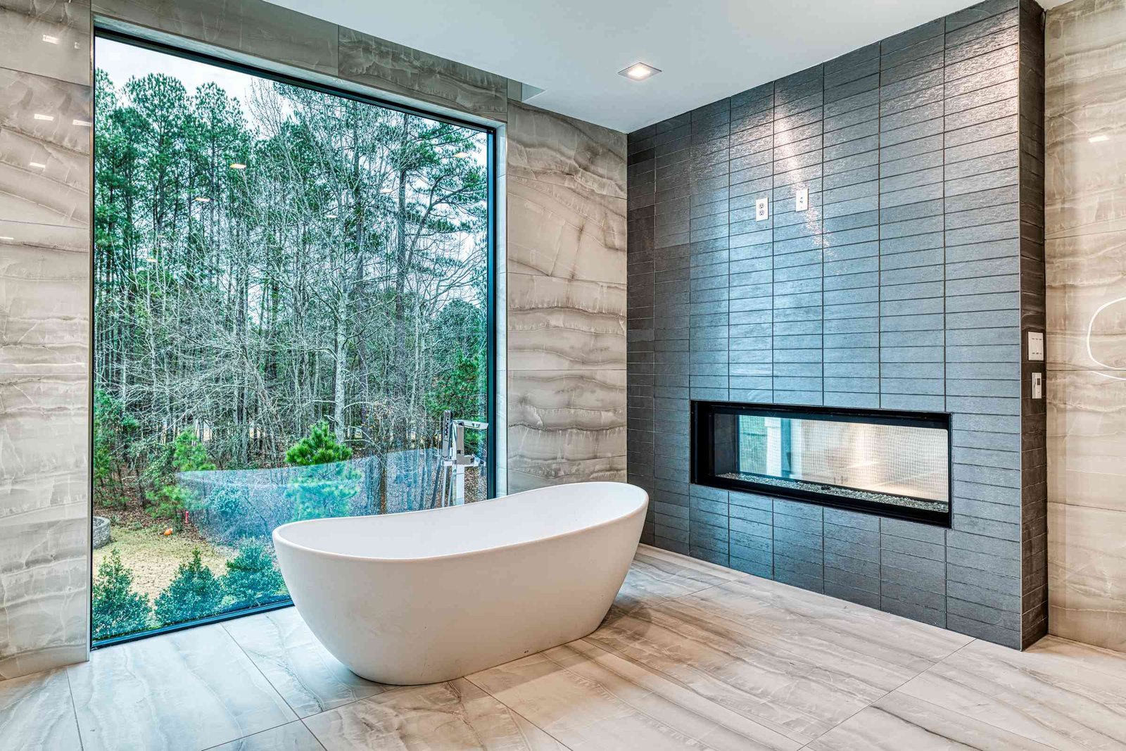 Upper level primary bathroom with skylights by Shail Construction in Raleigh NC