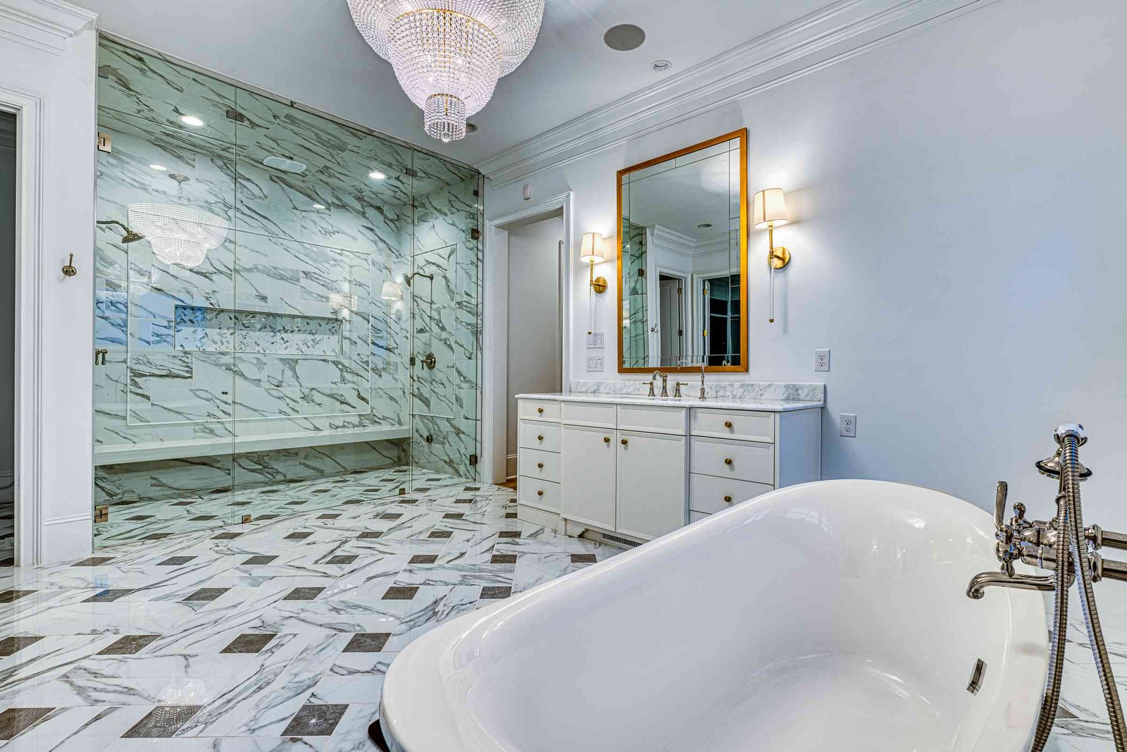 Owners suite bathroom with marble surround by Shail Construction in Raleigh NC