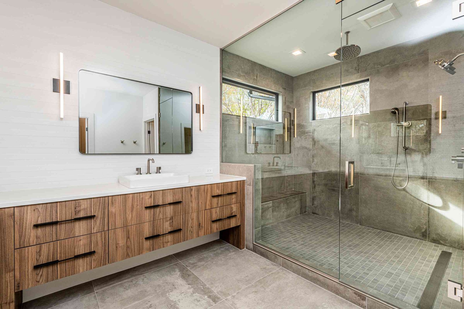 Owners bathroom with double vanity and freestanding tub by Shail Construction in Raleigh NC