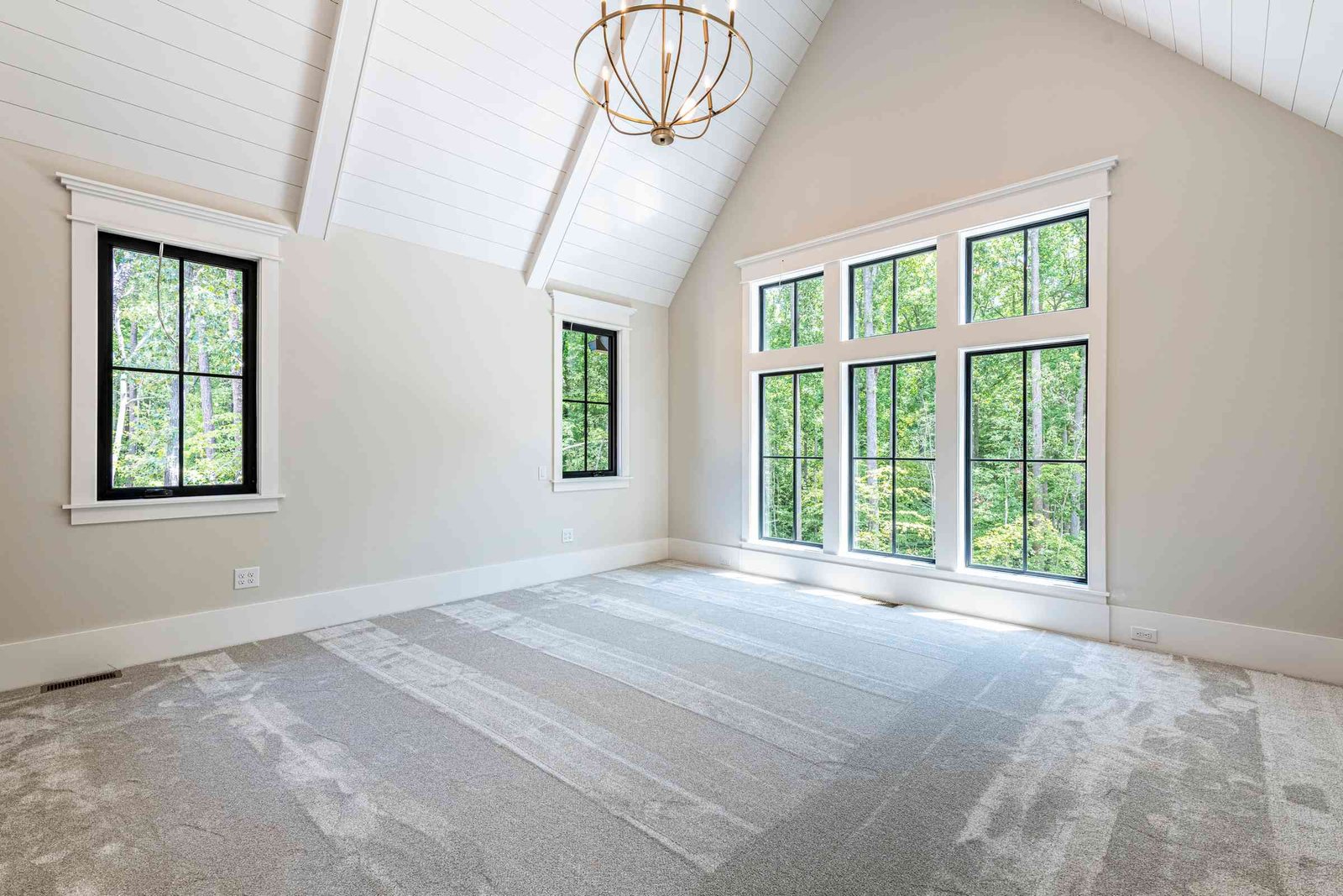 Primary bedroom with sitting area by Shail Construction in Raleigh NC