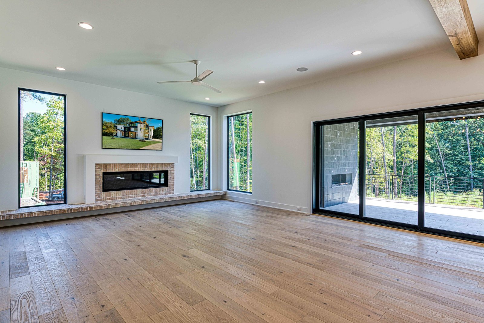 Coffered ceiling family room with exposed beams by Shail Construction in Raleigh NC