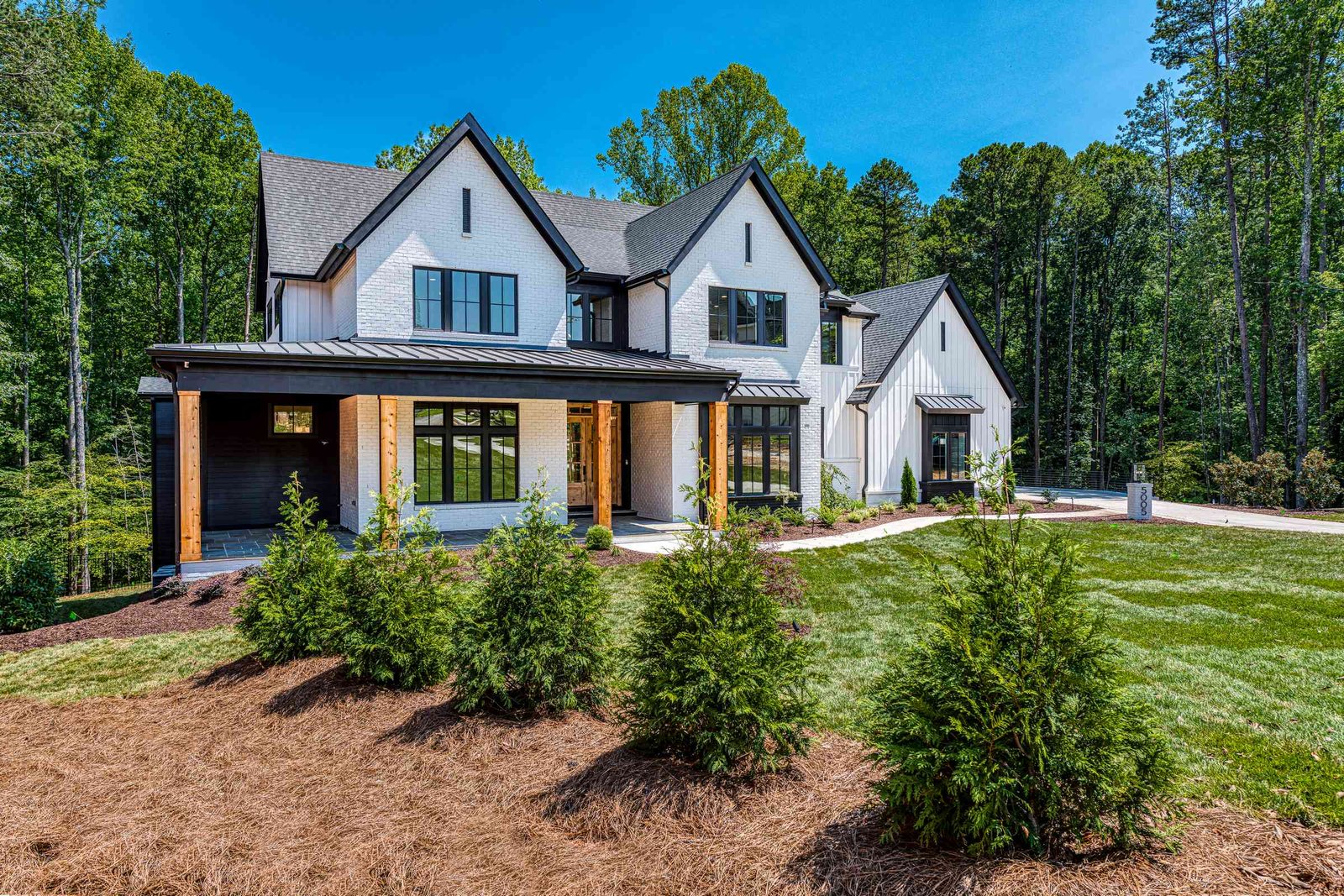 Painted brick custom home elevation by Shail Construction in Raleigh NC