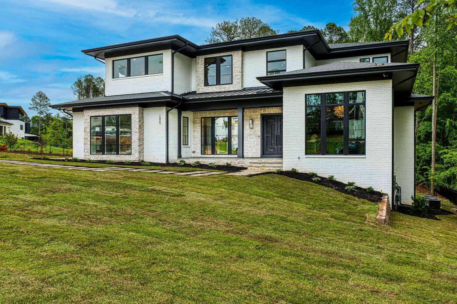 Modern transitional front exterior by Shail Construction in Raleigh NC