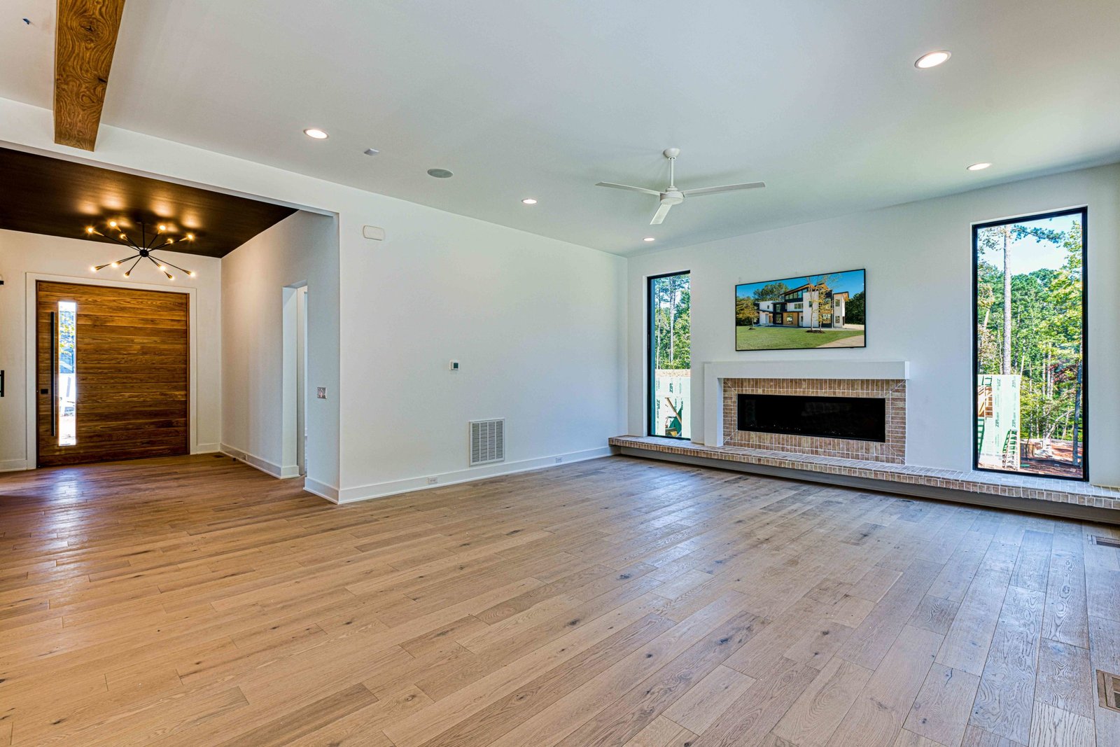 Open family room with built-in millwork by Shail Construction in Raleigh NC