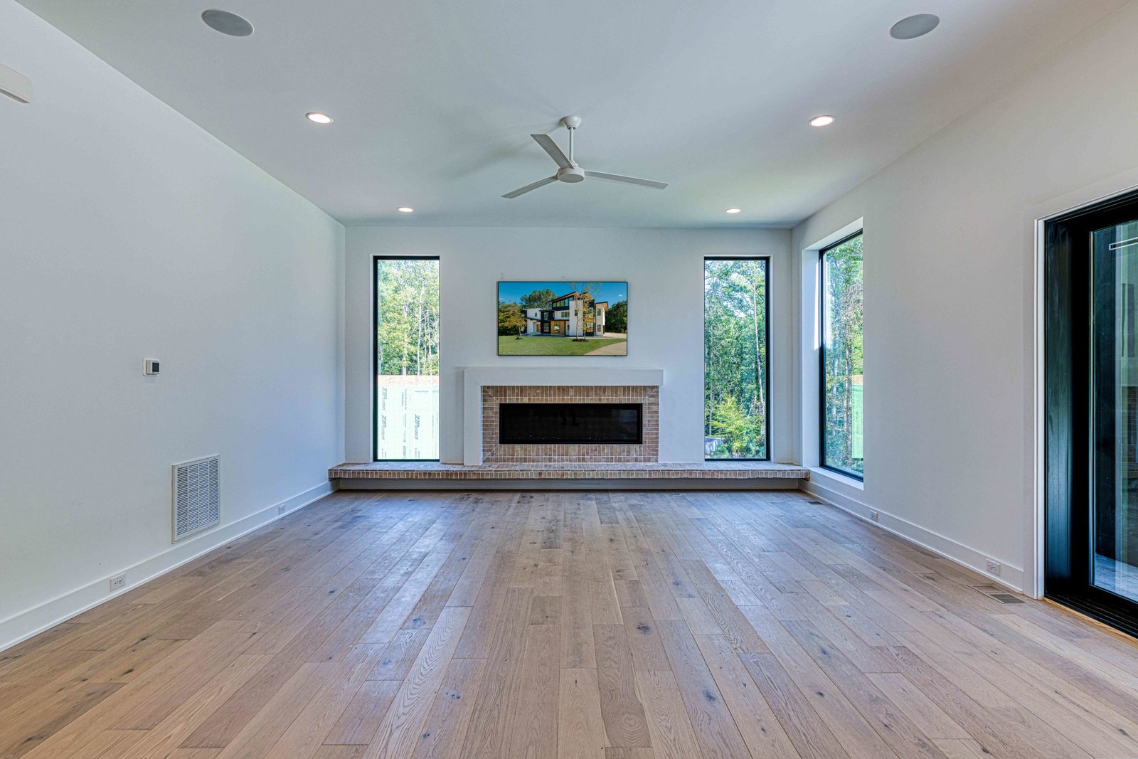 Family room with paneled walls and cathedral ceiling by Shail Construction in Raleigh NC