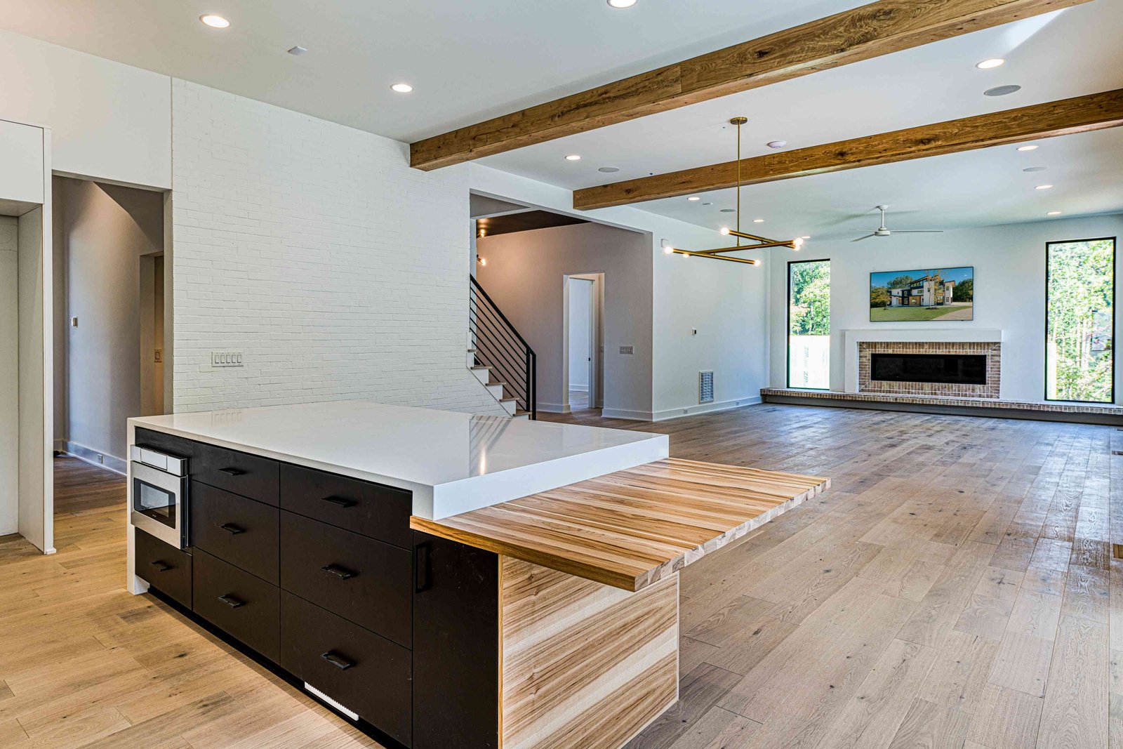 Open-plan kitchen with breakfast area by Shail Construction in Raleigh NC