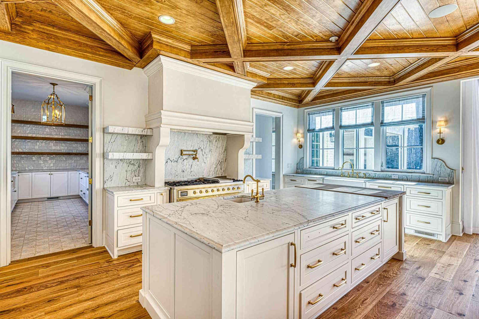 White kitchen with paneled appliances by Shail Construction in Raleigh NC