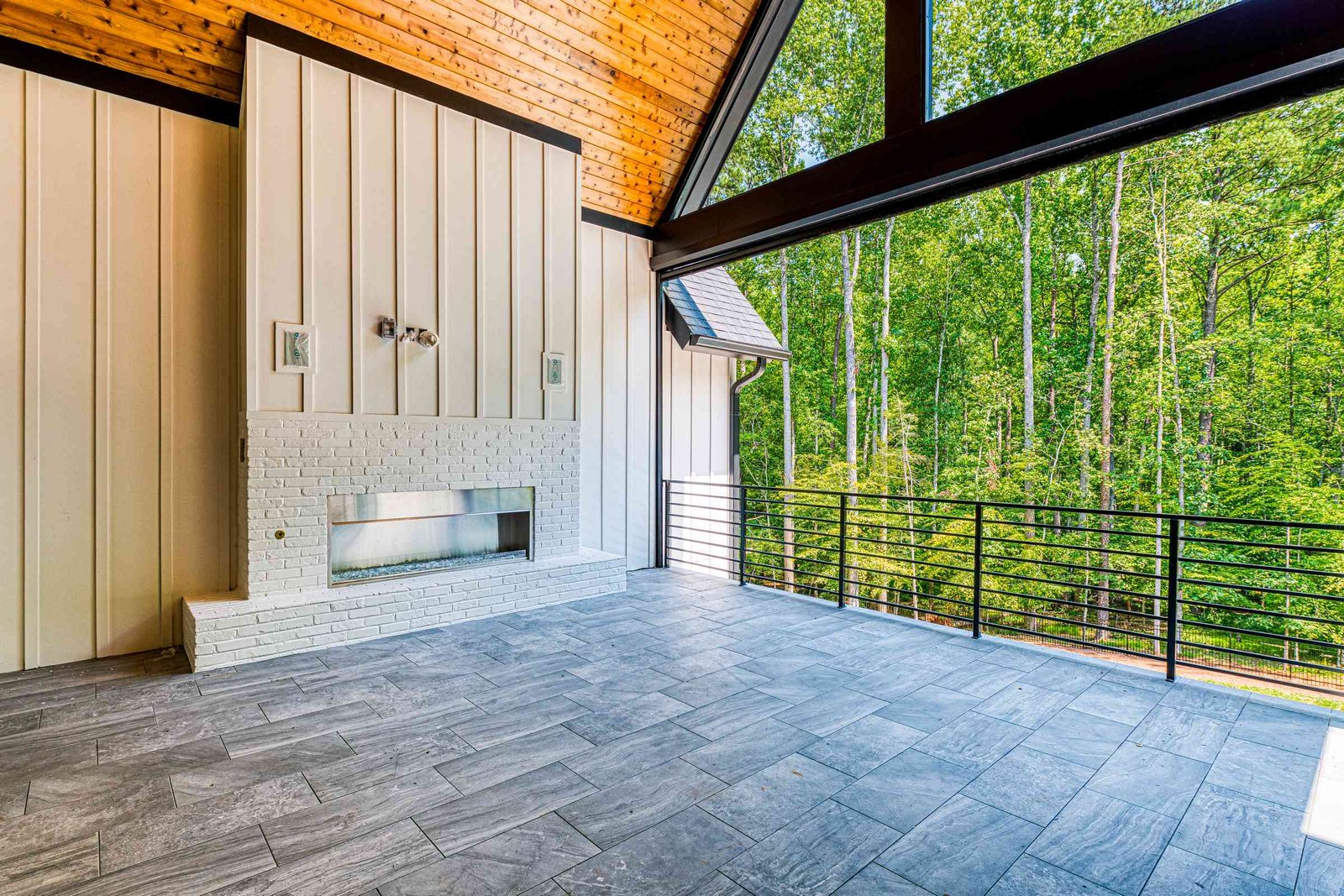 Veranda with cathedral ceiling and outdoor kitchen by Shail Construction in Raleigh NC