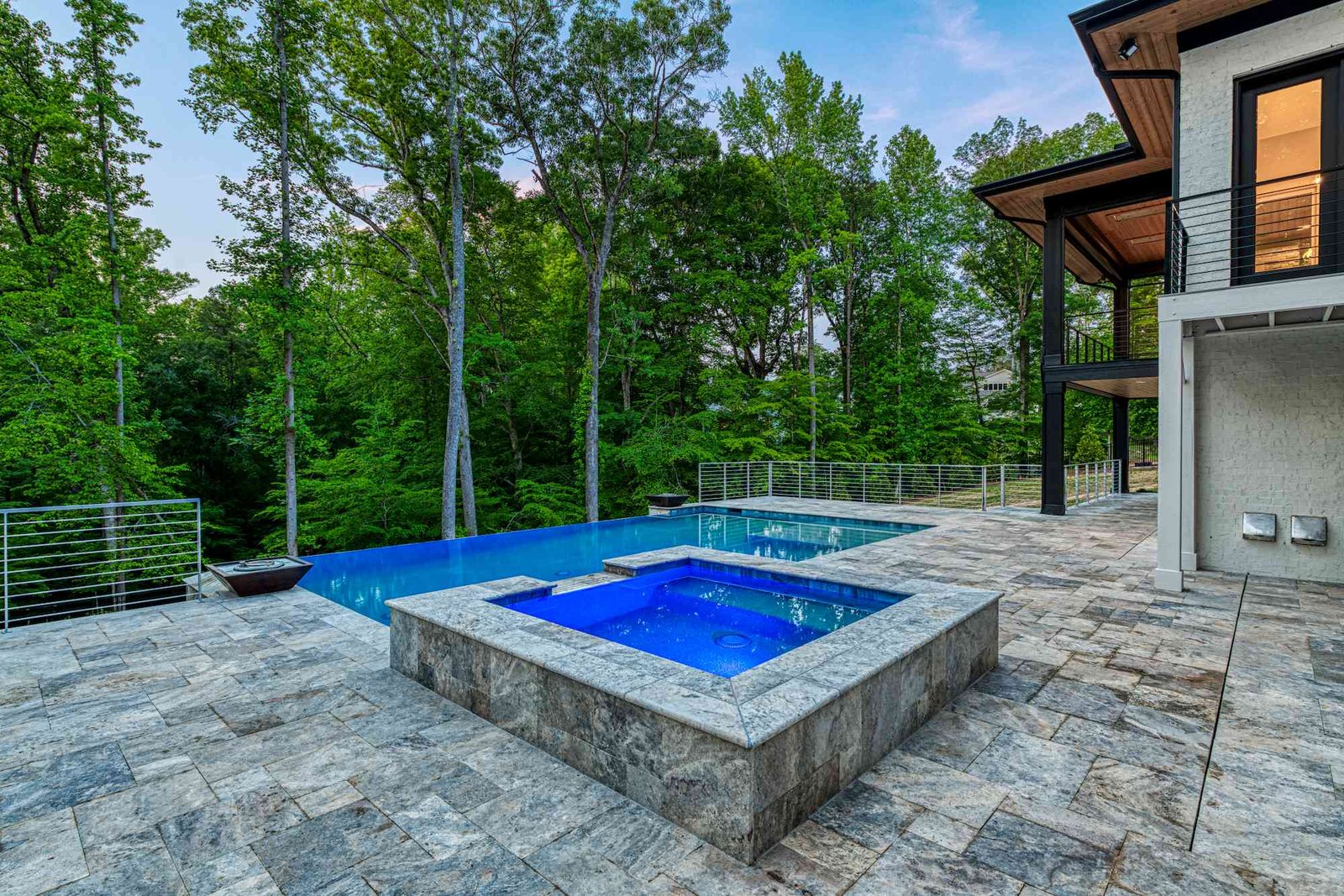 Afternoon pool with cabana and lounge chairs by Shail Construction in Raleigh NC