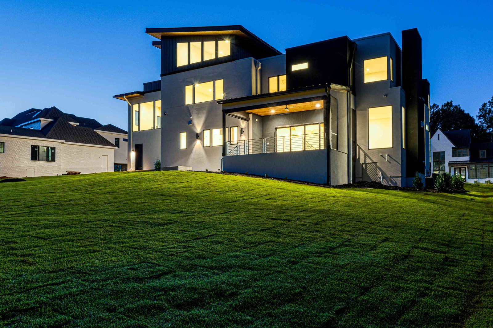 Dusk view of a custom estate rear elevation by Shail Construction in Raleigh NC