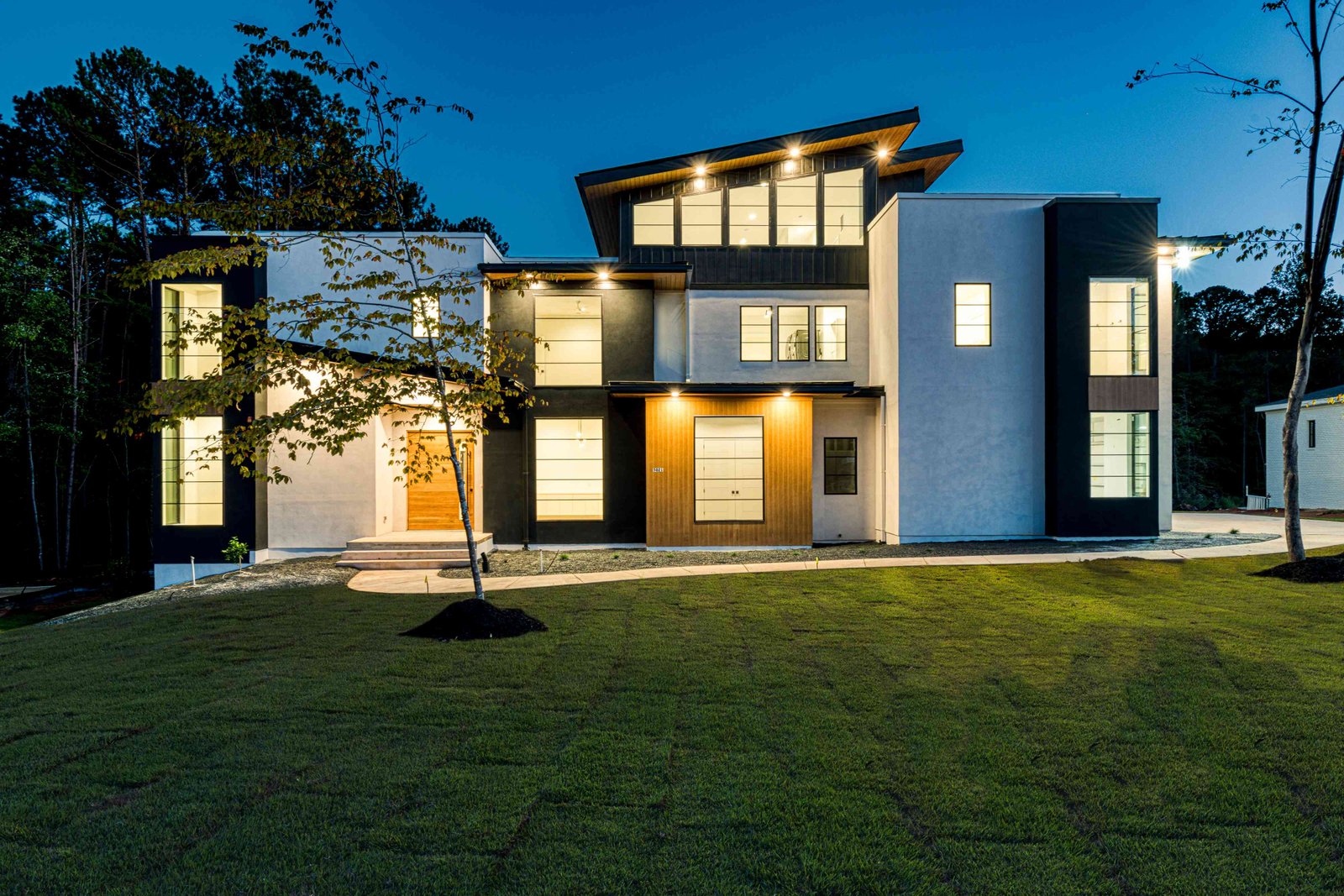 Twilight front exterior of a luxury custom estate by Shail Construction in Raleigh NC