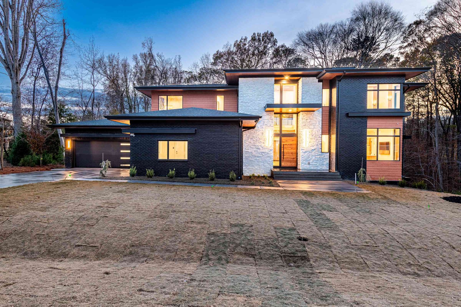 Wide twilight view of a custom luxury home by Shail Construction in Raleigh NC