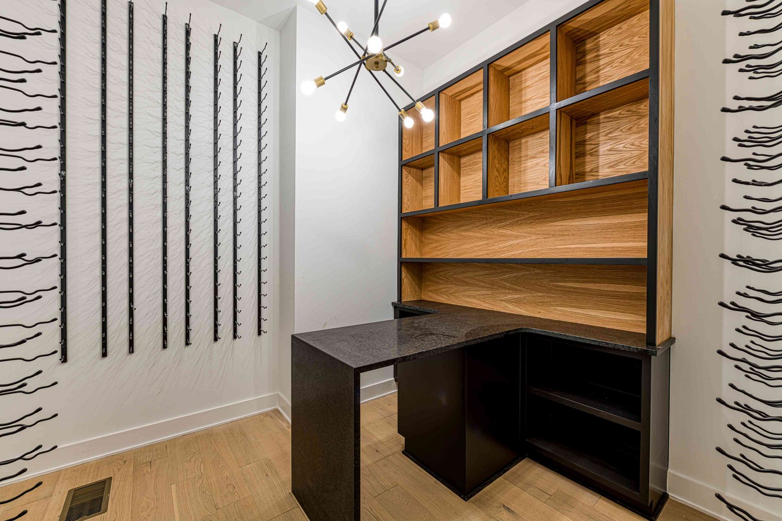 Glass wine room with feature lighting by Shail Construction in Raleigh NC