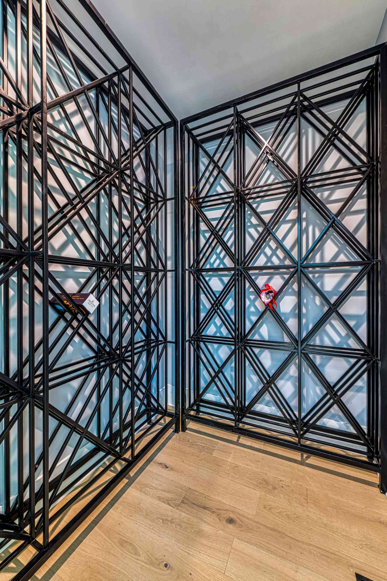 Climate-controlled wine cellar with stone walls by Shail Construction in Raleigh NC